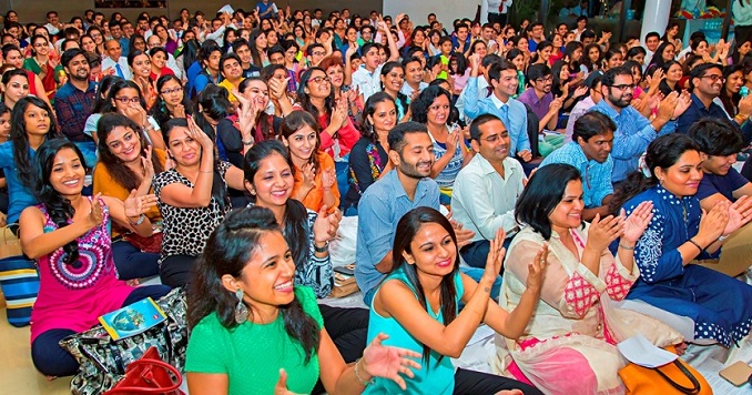 Bharat Soka Gakkai members clapping at a meeting