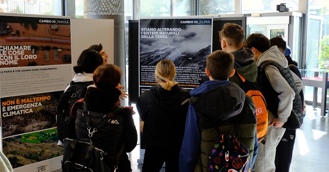 People looking at panels of a climate change exhibition