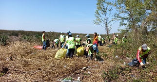 People collecting garbage in a national park.