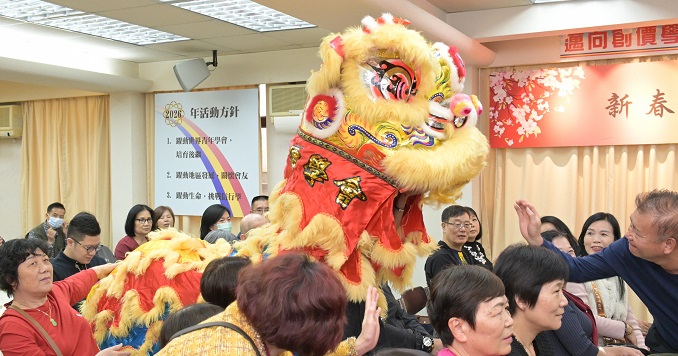 People enjoying a Chinese lion dance performance.