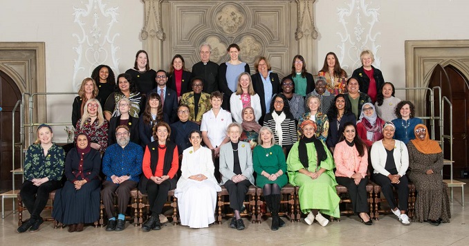 Participants from diverse faith traditions gather for a commemorative photograph.