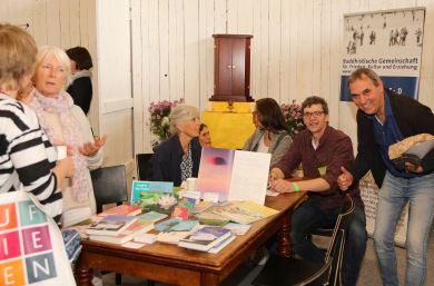 Discussions with visitors to the booth at the fair