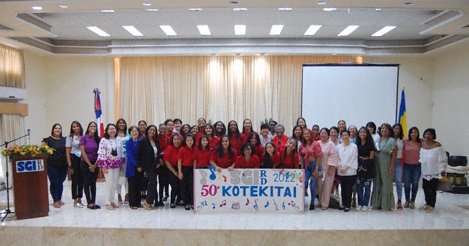 People standing on a stage for a group picture