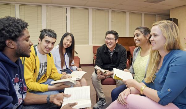 A group of seated youth having a discussion