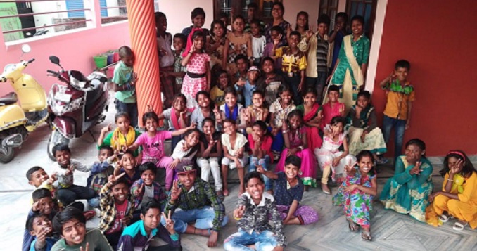 A large group of neatly dressed smiling children